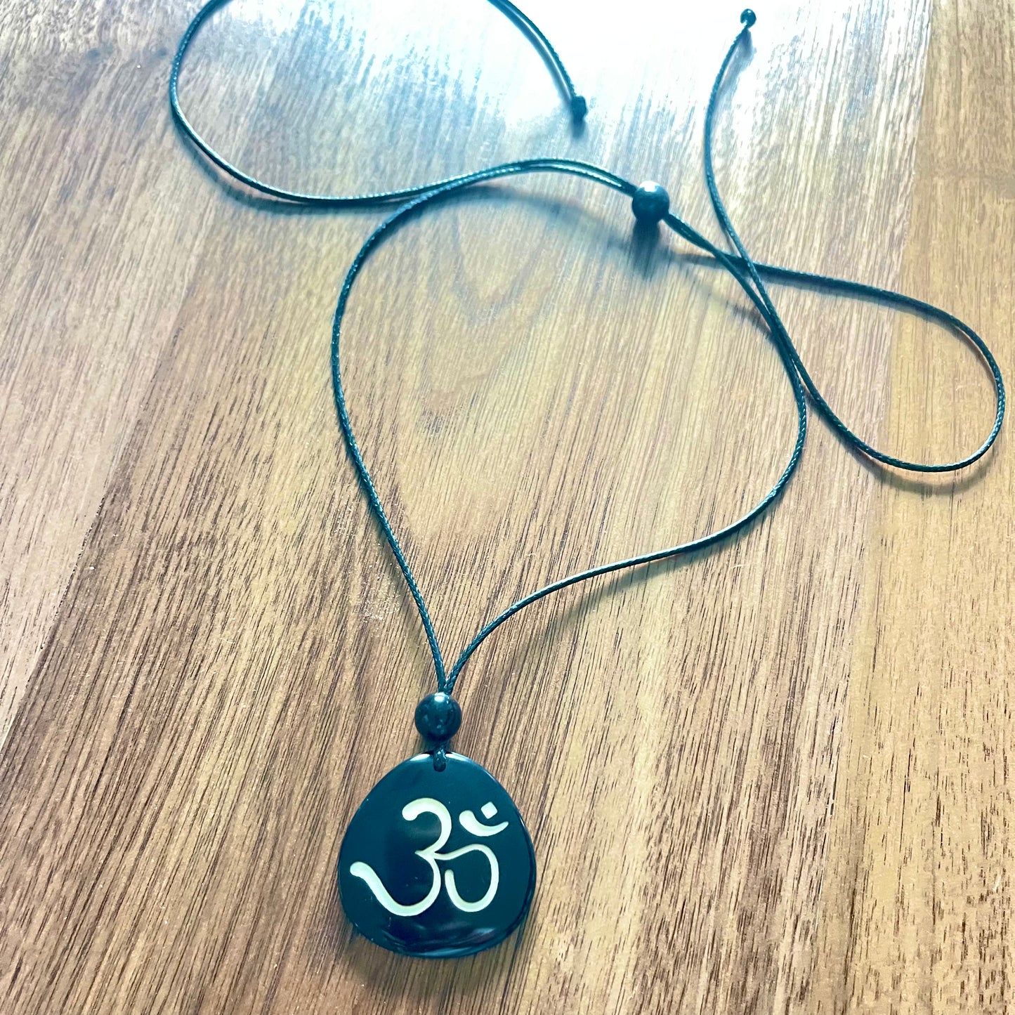 OM & BREATHE TAGUA NECKLACE