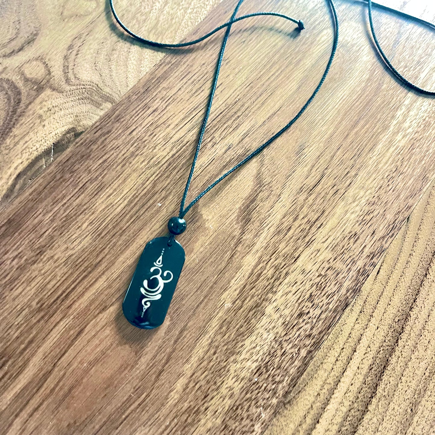 OM & BREATHE TAGUA NECKLACE