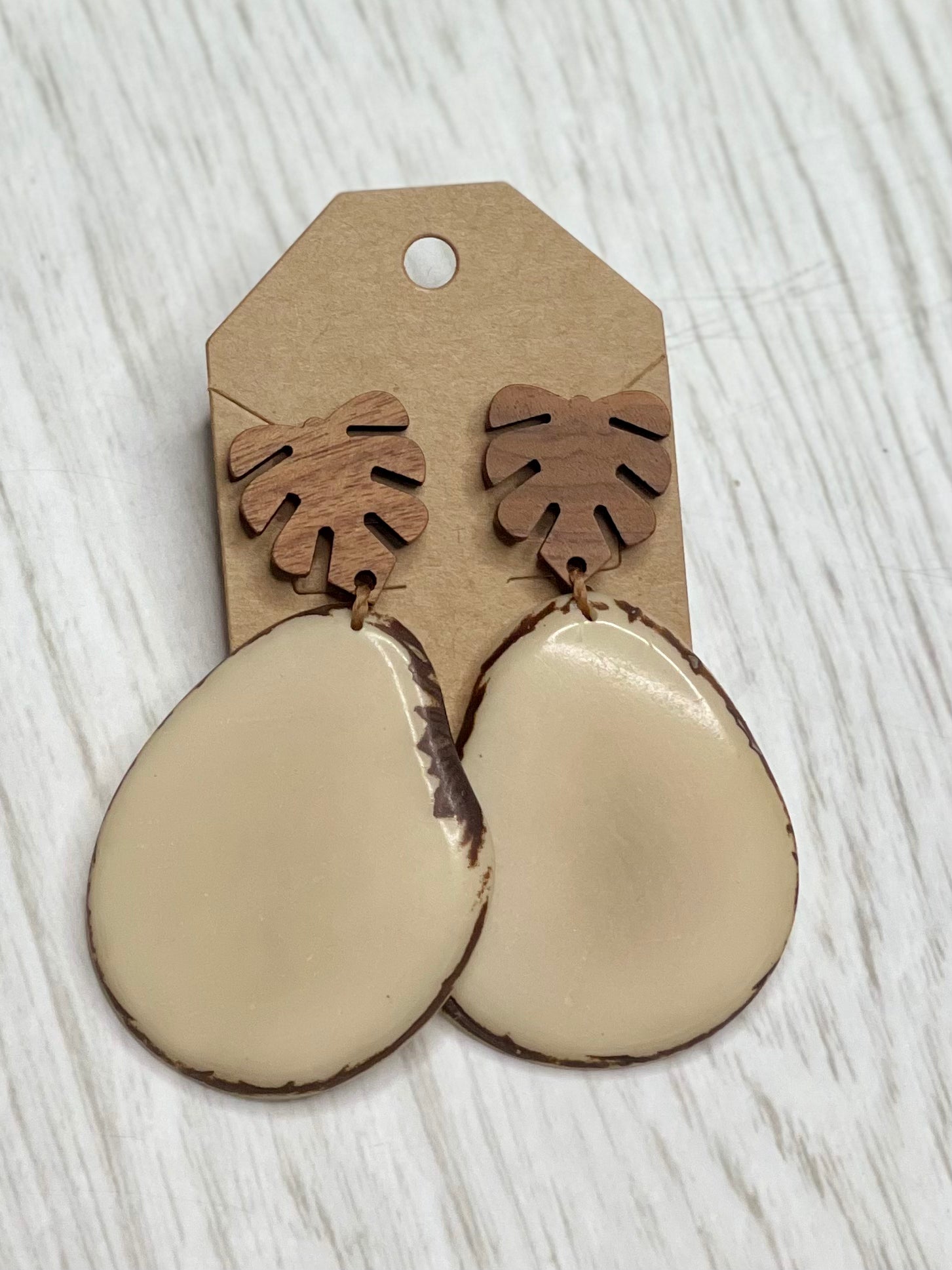 Tagua Earrings solid colorful tagua and wood monstera leaf design top with post earrings. tagua from Ecuador, made by artisans in Ecuador. Ecuador tagua jewelry. tropical earrings Tera ivory